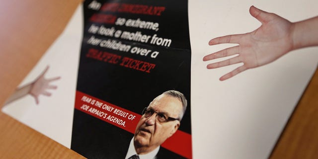 FILE - In this Sept. 13, 2016, file photo, a group backed by the New York hedge fund billionaire George Soros, a longtime bankroller of liberal political causes, is mailing anti-Joe Arpaio fliers to Phoenix-area voters. Paul Penzone, a former Phoenix police sergeant running against Arpaio, is getting a boost from the unlikely Soros source. The sheriff of metro Phoenix has won re-election by crafting an image as a law enforcer who targeted parents who skip out on child support, abusers of animals and immigrants who are in the country illegally. Now, Sheriff Joe Arpaio is the one being targeted in a criminal case after he was charged two weeks before Election Day with contempt-of-court for defying a judge's order in a racial profiling case. (AP Photo/Ross D. Franklin, File)