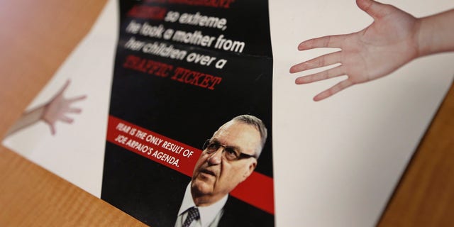 FILE - In this Sept. 13, 2016, file photo, a group backed by the New York hedge fund billionaire George Soros, a longtime bankroller of liberal political causes, is mailing anti-Joe Arpaio fliers to Phoenix-area voters. Paul Penzone, a former Phoenix police sergeant running against Arpaio, is getting a boost from the unlikely Soros source. The sheriff of metro Phoenix has won re-election by crafting an image as a law enforcer who targeted parents who skip out on child support, abusers of animals and immigrants who are in the country illegally. Now, Sheriff Joe Arpaio is the one being targeted in a criminal case after he was charged two weeks before Election Day with contempt-of-court for defying a judge's order in a racial profiling case. (AP Photo/Ross D. Franklin, File)