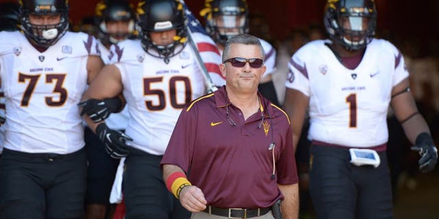 Oct 4, 2014; Los Angeles, CA, USA: Arizona State Sun Devils coach Todd Graham leads players onto the field before the game against the Southern California Trojans at Los Angeles Memorial Coliseum. Mandatory Credit: Kirby Lee-USA TODAY Sports