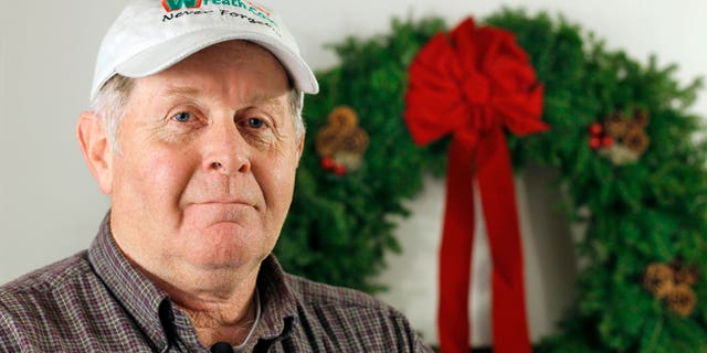 Dec. 2010: Morrill Worcester, president of the Worcester Wreath Co., and founder of the Wreaths Across America mission, poses in Columbia Falls, Maine. Each December for the past 20 years, Worcester's company has placed between 10,000 and 24,000 wreaths on graves at Arlington National Cemetery. This year Worcester has set his sights on placing wreaths on all 220,000 headstones at the cemetery to pay tribute to the nation's veterans.