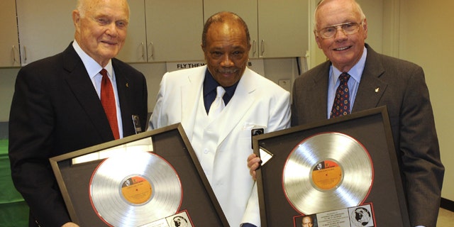 Grammy Award-winning producer Quincy Jones (center) presented a platinum copy of "Fly Me to the Moon" to Senator John Glenn (left) and Apollo 11 Commander Neil Armstrong (right) during NASA's 50th anniversary gala in 2008.