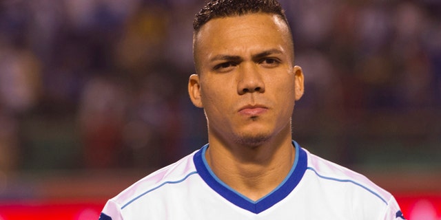 FILE - In this March 5, 2014 file photo, Honduras' soccer player Arnold Peralta prior to a friendly match against Venezuela in San Pedro Sula, Honduras. Peralta's father Carlos confirmed his son was killed on Thursday, Dec. 10, 2015 in his hometown of La Ceiba. Honduran authorities say he was shot dead by an unidentified gunman on a motorcycle in a shopping mall parking lot. (AP Photo/Moises Castillo, File)