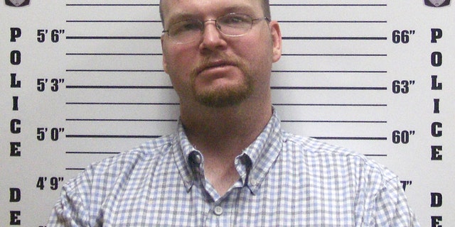 Justin Harrel in booking photo released by Elk City, Ok.