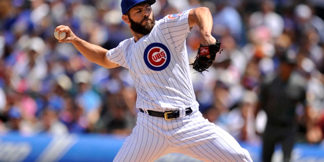 Chicago Cubs starter Jake Arrieta delivers a pitch during the first inning of a baseball game against the Arizona Diamondbacks, Sunday, June 5, 2016, in Chicago. (AP Photo/Paul Beaty)
