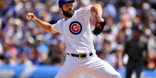 Chicago Cubs starter Jake Arrieta delivers a pitch during the first inning of a baseball game against the Arizona Diamondbacks, Sunday, June 5, 2016, in Chicago. (AP Photo/Paul Beaty)