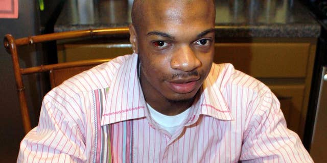 FILE - In this Jan. 22, 2010 file photo, Jordan Miles, then an 18-year-old high school student, talks about his hopes to go to college to study crime scene investigation at his home in Pittsburgh. Three white officers accused in a federal civil rights lawsuit of beating Miles falsely arrested him but didn't use excessive force, a jury found Monday, March 31, 2014, awarding him $119,000 in damages. (AP Photo/Keith Srakocic, File)