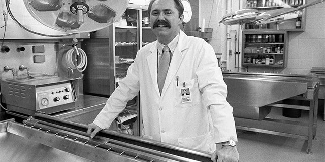 Federal authorities reportedly discovered four preserved fetuses in the Detroit warehouse of Arthur Rathburn, pictured here at the University of Michigan in Ann Arbor in November 1988.