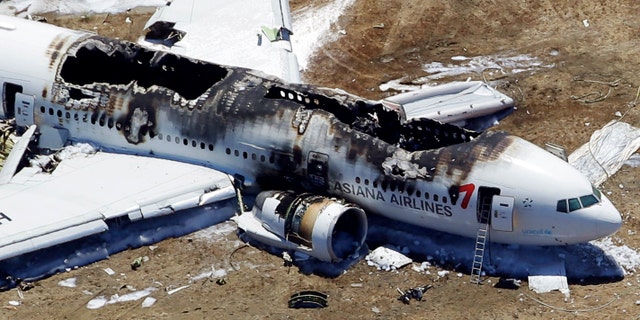 This aerial photo shows the wreckage of the Asiana Flight 214 airplane after it crashed at the San Francisco International Airport in San Francisco, Saturday, July 6, 2013. (AP Photo/Marcio Jose Sanchez)