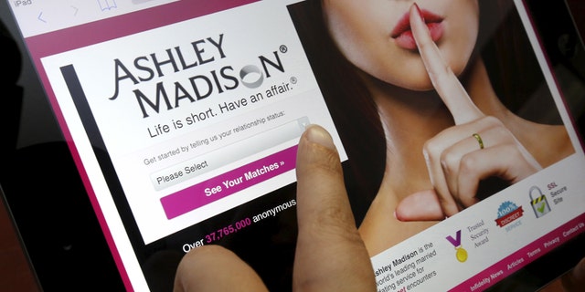 The homepage of the Ashley Madison website is displayed on an iPad, in this photo illustration taken in Ottawa, Canada July 21, 2015.