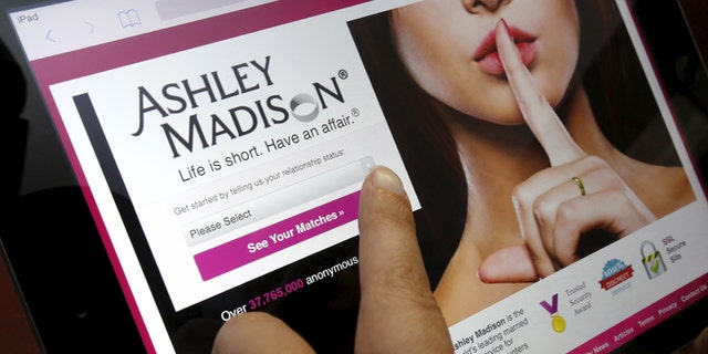 The homepage of the Ashley Madison website is displayed on an iPad, in this photo illustration taken in Ottawa, Canada July 21, 2015.