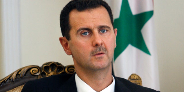 This Aug. 19, 2009 file photo shows Syrian President Bashar Assad during a meeting with his Iranian counterpart Mahmoud Ahmadinejad, unseen, at the presidency in Tehran, Iran.