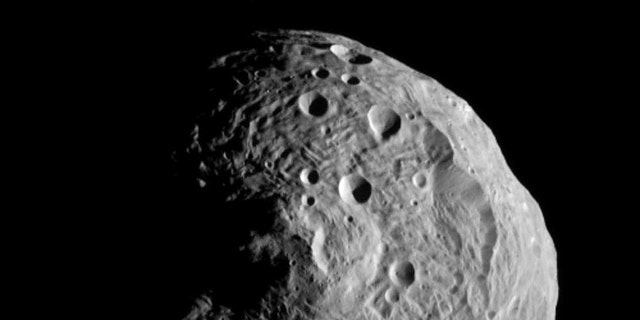 July 17, 2011: The asteroid Vesta, photographed by the Dawn spacecraft. The image was taken from a distance of about 9,500 miles (15,000 kilometers) away.