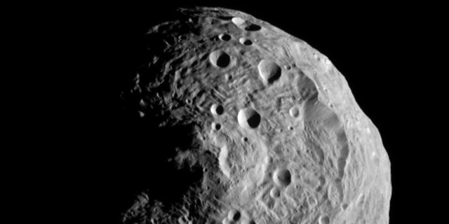 July 17, 2011: The asteroid Vesta, photographed by the Dawn spacecraft. The image was taken from a distance of about 9,500 miles (15,000 kilometers) away.