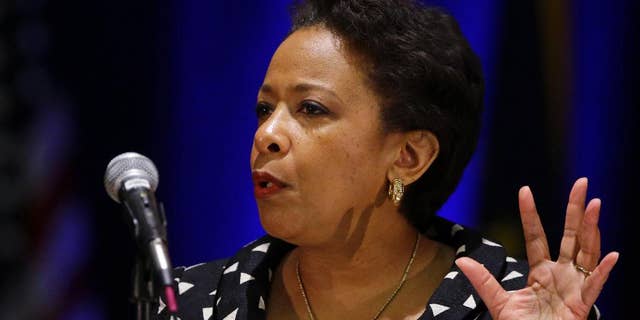 FILE - In this Monday, July 13, 2015, file photo, U.S. Attorney General Loretta E. Lynch delivers the keynote address at the National Organization of Black Law Enforcement Executives training conference in Indianapolis. Lynch is bringing her national community policing tour to Connecticut, where she will highlight changes East Haven police have made over the last several years to strengthen ties with local residents. (AP Photo/Michael Conroy, File)