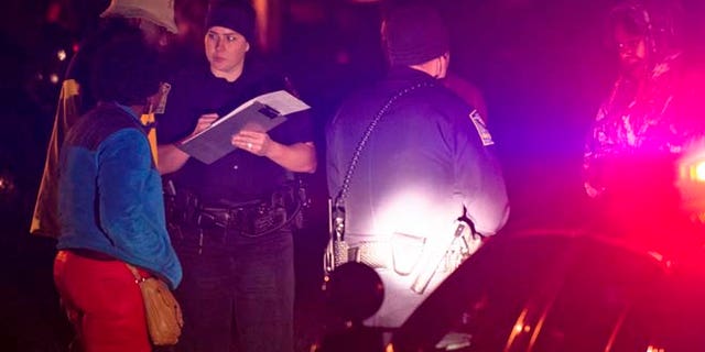 Dec. 14, 2014: Auburn Police investigate a shooting at the Tiger Lodge apartments in Auburn, Ala. (AP/Montgomery Advertiser/Albert Cesare)