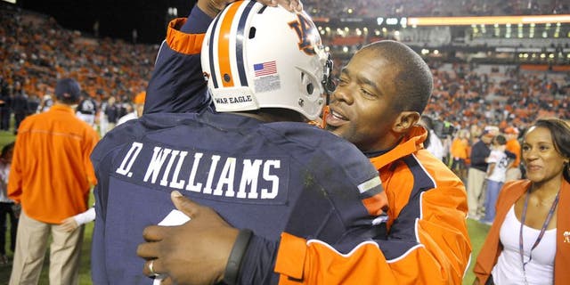 Oct 4, 2014; Auburn, AL, USA; Auburn Tigers wide receiver D'haquille Williams (1) hugs co-offensive coordinator Dameyune Craig after the game against the LSU Tigers at Jordan Hare Stadium. Auburn won 41-7. Mandatory Credit: Shanna Lockwood-USA TODAY Sports