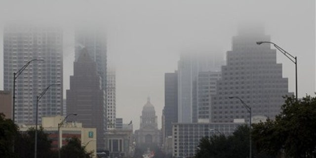 Jan. 24, 2012: The Texas Capitol and downtown buildings fade into the fog in Austin, Texas.