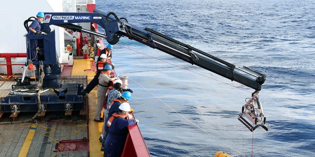 In this Monday, April 14, 2014, photo provided by the Australian Defense Force an autonomous underwater vehicle is deployed from ADV Ocean Shield in the search of the missing Malaysia Airlines Flight 370 in the southern Indian Ocean. The search area for the missing Malaysian jet has proved too deep for the robotic submarine which was hauled back to the surface of the Indian Ocean less than half way through its first seabed hunt for wreckage and the all-important black boxes, authorities said on Tuesday. (AP Photo/Australian Defense Force, Lt. Kelli Lunt) EDITORIAL USE ONLY