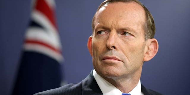 FILE - In this Sept. 19, 2014 file photo, Australian Prime Minister Tony Abbott speaks during a press conference, in Sydney. (AP Photo/Rick Rycroft, File)