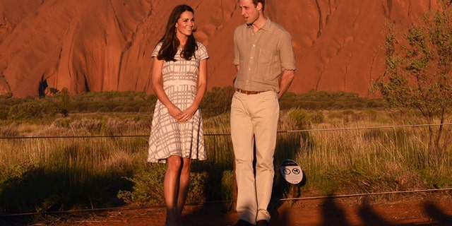 April 22, 2014: Britain's Prince William and his wife, Kate, Duchess of Cambridge, pose for a photo at sunset in Uluru, Australia.