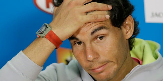 Spain's Rafael Nadal answers a question during a press conference ahead of the Australian Open tennis championship in Melbourne, Australia, Saturday, Jan. 17, 2015. (AP Photo/Lee Jin-man)