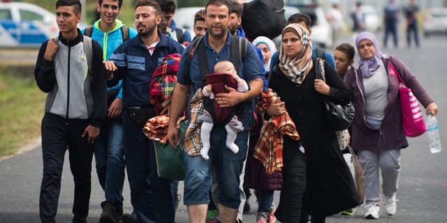 Sept. 14, 2015: Refugees arrive at the border between Austria and Hungary near Heiligenkreuz.