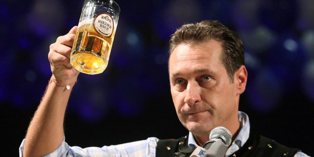 Feb. 22, 2012: In this file photo head of the Austrian right-wing Freedom Party Heinz-Christian Strache lifts a glass of beer during his traditional Ash Wednesday speech in Ried, Austria.