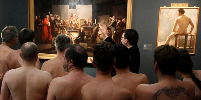 Feb. 18, 2013: Naked Museum visitors look at pictures of the show "Nude Men from 1800 to Today" during a special opening to friends of nudism at the Leopold Museum, Vienna, Austria.