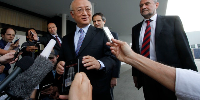 May 20, 2012: Director General of the International Atomic Energy Agency, IAEA, Yukiya Amano from Japan and Herman Nackaerts, from left, of the IAEA the chief agency official in charge of the Iran file speak to the media before his flight to Iran at the Vienna International Airport near Schwechat, Austria.