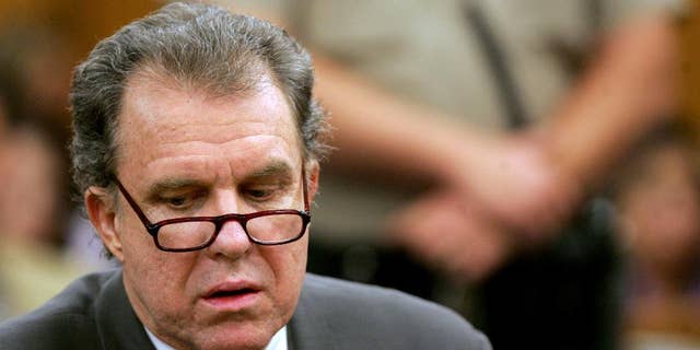 FILE - In this Jan. 4, 2007 file photo, Michael Goodwin looks down as the verdict is read in his trial in Pasadena, Calif. Goodwin was found guilty in the slayings of racing legend Mickey Thompson and his wife. A California appeals court has upheld convictions in the murders of Thompson and his wife. A three-judge panel on Monday, Jan. 26, 2015 said it found no prejudicial errors in the trial of Goodwin. Goodwin, 69, is serving life in prison without parole in the 1988 slayings of Mickey and Trudy Thompson. (AP Photo/Los Angeles Times, Francine Orr, Pool, File)