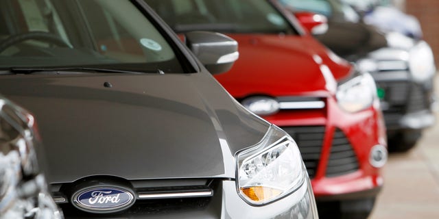 This Feb. 19, 2012 photo, shows a line of 2012 Focus sedans at a Ford dealership in the south Denver suburb of Littleton, Colo. Ford Motor Co. said Thursday, March 1, 2012, its U.S. sales rose 14 percent in February thanks to big demand for its Focus compact car. (AP Photo/David Zalubowski)