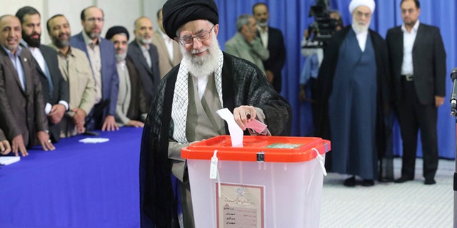 In this June 14, 2013 file photo, Iran's Supreme Leader Ayatollah Ali Khamenei casts his ballot at his office during the Iranian presidential election in central Tehran.