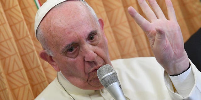 Pope Francis speaks with journalists on board the flight from Baku to Rome, Sunday, Oct. 2, 2016.