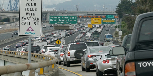 Late morning commute getting to the San Francisco-Oakland Bay Bridge toll plaza, Oct. 21, 2013, in Oakland, Calif.