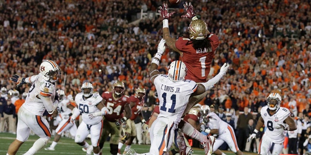 Florida State's Kelvin Benjamin catches the game-winning touchdown pass during the second half of the NCAA BCS National Championship college football game against Auburn Monday, Jan. 6, 2014, in Pasadena, Calif. (AP Photo/Chris Carlson)