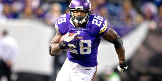 Dec 1, 2013; Minneapolis, MN, USA; Minnesota Vikings running back Adrian Peterson (28) rushes for 21 yards against the Chicago Bears in overtime at Mall of America Field at H.H.H. Metrodome. Vikings win 23-20 in overtime. Mandatory Credit: Bruce Kluckhohn-USA TODAY Sports