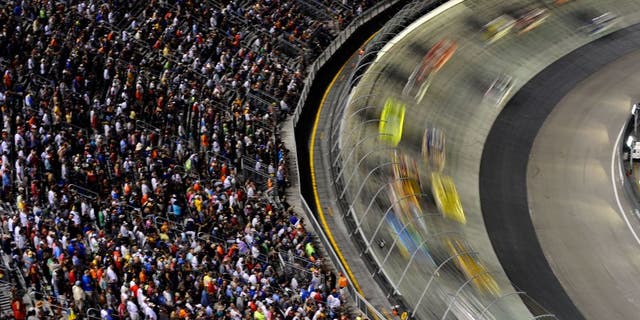 BRISTOL, TN - AUGUST 25: Cars race during the NASCAR Sprint Cup Series IRWIN Tools Night Race at Bristol Motor Speedway on August 25, 2012 in Bristol, Tennessee. (Photo by Jared C. Tilton/Getty Images)