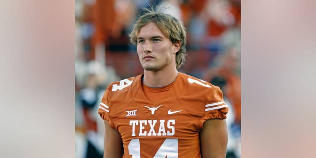 Texas quarterback David Ash comes onto the field before an NCAA college football game against BYU in Austin, Texas, Saturday, Sept. 6, 2014. (AP Photo/Michael Thomas)