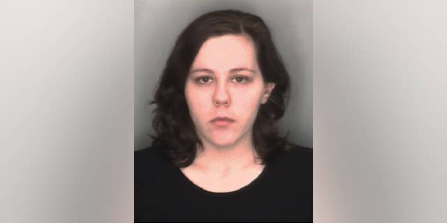 In this undated booking photo released by the Redford Township, Mich., Police Department, Kimberly Pappas, 26, is shown. The Detroit-area woman accused of giving birth at work and hiding the boy in a plastic bag in a desk drawer was ordered Monday, Aug. 24, 2015, to stand trial on murder and child abuse charges. (Redford Township Police Department via AP)