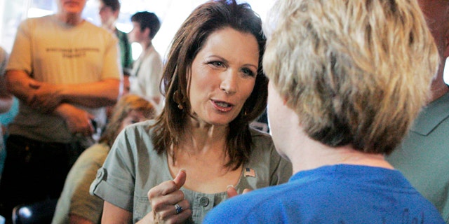 July 2: GOP presidential candidate Michele Bachmann speaks with a potential voter in Iowa City.