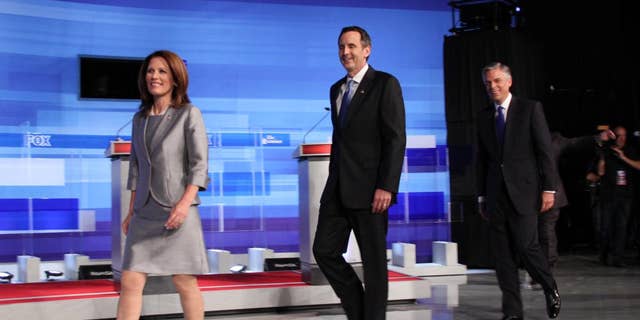 Candidates Michele Bachmann, Tim Pawlenty and Jon Huntsman take the stage at Thursday's Fox News, Washington Examiner, Iowa GOP presidential debate. (Fox News Photo)