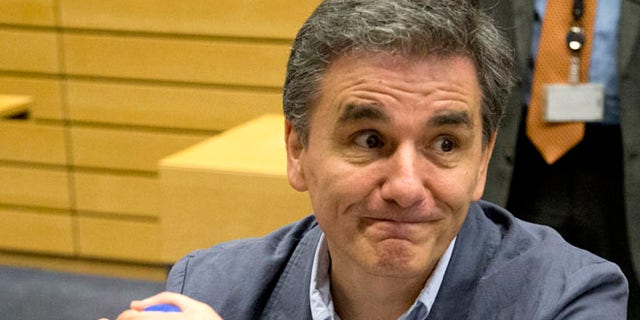 July 7: Greek Finance Minister Euclid Tsakalotos waits for the start of a round table meeting of eurozone finance ministers in Brussels.