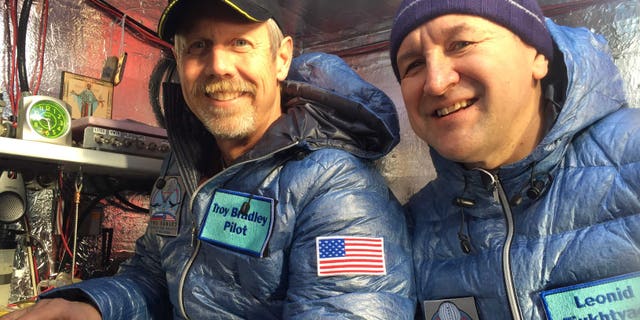This Jan. 8, 2015 photo provided by Tami Bradley-Two Eagles Balloon Team, shows pilots from left, Troy Bradley of Albuquerque, N.M., and Leonid Tiukhtyaev of Russia, before they lift off in a gas balloon in Saga, Japan. The Two Eagles pilots have traveled farther and longer in a gas balloon than anyone in history in a bid to remove the qualifiers that have complicated a century of record keeping in long-distance ballooning. Now they're aiming for a safe landing on the beaches of Baja California. (AP Photo/Tami Bradley-Two Eagles Balloon Team)