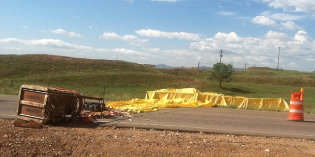 June 8, 2013: This photo provided by the Arvada (Colo.) Fire Department shows a hot air balloon that crashed, Saturday, June 8, 2013 in Arvada, Colo. Authorities say gusty winds sweeping through the Denver area Saturday caused several hot air balloon crashes that injured at least five people.