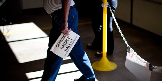 SPARKS, NV - NOVEMBER 6: A voter arrives to cast his ballot at Truckee Meadows Fire Station November 6, 2012 in Sparks, Nevada. As Americans go to vote, President Barack Obama and Republican nominee former Massachusetts Gov. Mitt Romney remain in a virtual tie in the national polls. (Photo by Max Whittaker/Getty Images)