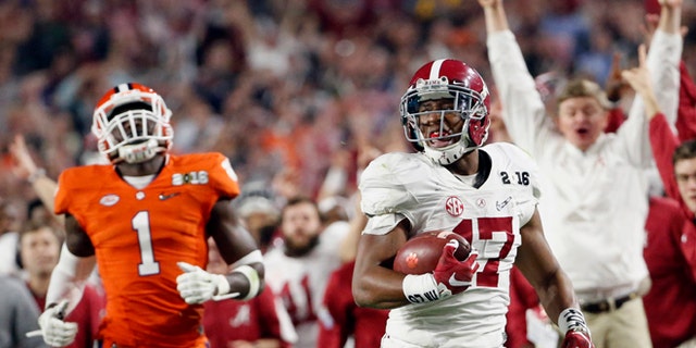 Alabama's Kenyan Drake, right, breaks away for a touchdown return against Clemson's Jayron Kearse (1) during the second half of the NCAA college football playoff championship game Monday, Jan. 11, 2016, in Glendale, Ariz. (Michael Chow/The Arizona Republic via AP) MARICOPA COUNTY OUT; MAGS OUT; NO SALES; MANDATORY CREDIT