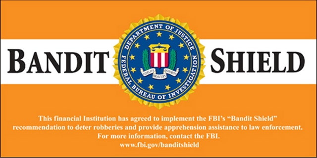 Banks that comply with the Bandit Shield Initiative will be rewarded with these Bandit Shield decals to be affixed to their doors by the FBI.
