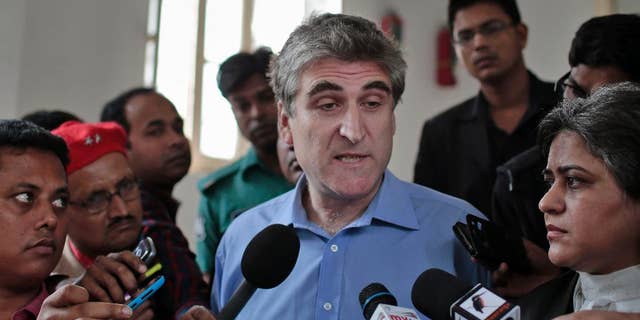 British journalist David Bergman speaks to journalists outside the International Crimes Tribunal court building in Dhaka, Bangladesh, Tuesday, Dec. 2, 2014. A court in Bangladesh dealing with war crimes committed during Bangladesh’s 1971 war of independence has found Bergman guilty of contempt for questioning the official death toll of that conflict. (AP Photo/A.M. Ahad)