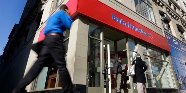 People walk past a Bank of America branch in New York.