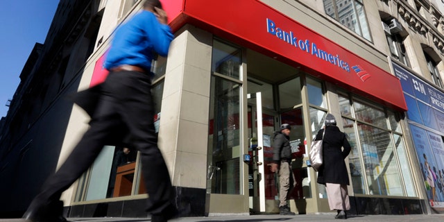 People walk past a Bank of America branch in New York.